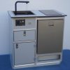 All-in-one self-contained camper van kitchen unit with sink, induction cooktop, fridge, and water system for Sprinter van conversion